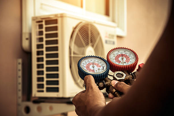 Professional Hvac technician working in Milford, MA